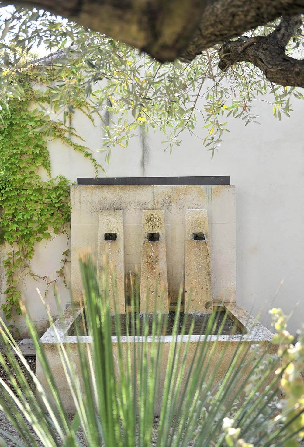 village house paradou garden fountain